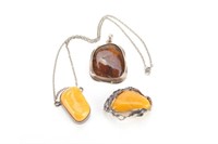 Three amber & silver necklace pendants