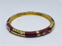 RED AND GOLD TONE BRACELET