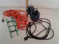 Three extension cords and cord wrapper