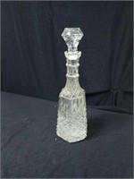 Colorless decanter aporox 14 inches tall