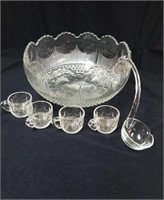 Nice heavy glass punch bowl with 18 cups with a