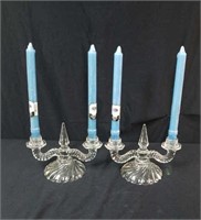 Graceful pair of colorless candleholders with