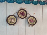 Floral grouping of home interior plates in a