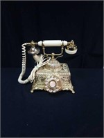 Engaging gold and ivory colored rotary dial