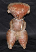 PRE-COLUMBIAN RED GLAZED FIGURE ON METAL STAND