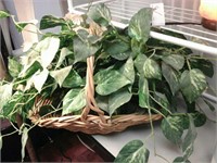 Wicker basket with silk leaves