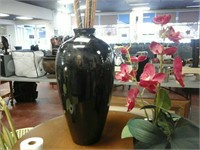 Black vase with stick decor