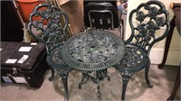 Cast metal table and chairs for the patio, the