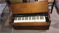 Antique portable oak pump organ, it has legs but