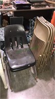 Pair of molded black plastic chairs, set of four