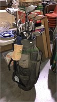 Golf bag with Nicholas clubs and woods and more