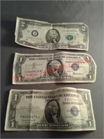 $2 bill and 2 silver certificates currency