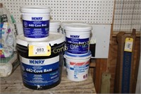 Lot of cove base adhesive, ceiling texture