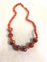Premade red glass bead necklace with colored spots