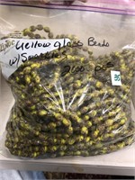 Yellow glass beads with speckles