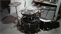 Part of a drum set and a fender amp