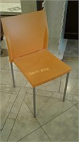 8 Orange stackable chairs