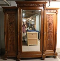 ORNATELY CARVED LATE 19TH C. ARMOIRE W/ BEVELED