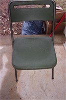 Green plastic folding chair