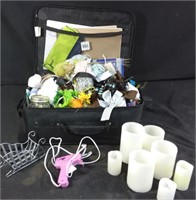 Small suitcase filled with assorted crafting