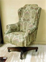 Upholstered Wing Back Swivel Office Chair.