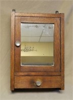 Oak Medicine Cabinet with Mirrored Door.