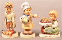3 Hummel Figurines including In the Kitchen. All
