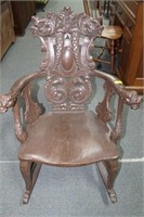 CARVED BACK OAK ROCKING CHAIR WITH ASIAN DRAGON