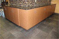 Reverse L-shaped granite countertop/cabinet unit