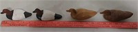 Four wooden miniature duck decoys