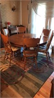 Oak 60” Round Claw Ft Table & 6 Chairs