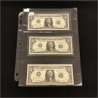Three $1 US Federal Reserve Notes