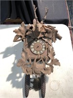 Old German cuckoo clock with stag head and Oak