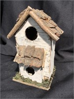 New handmade birdhouse from birch bark and pine