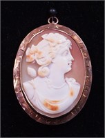 A cameo pin/pendant in 10K rose gold setting,