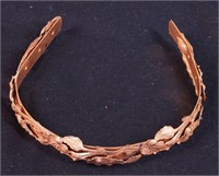 A Miriam Haskell gold-colored floral headband