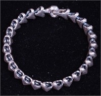 A sterling silver bracelet marked DY 925