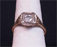 A woman's 14K gold ring with diamonds,