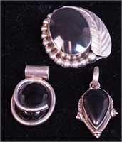 Three silver and black onyx Mexican