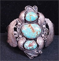 An unmarked silver and turquoise cuff