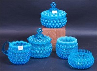 Five pieces of blue hobnail, some opalescent,