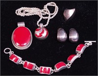 Set of silver and coral-colored jewelry, some