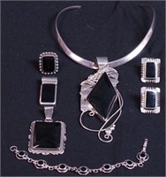 Group of silver and onyx jewelry