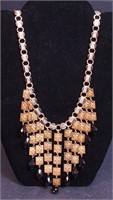 A Hobe' gold and black book chain-style necklace