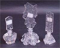 Three cut glass perfume bottles with