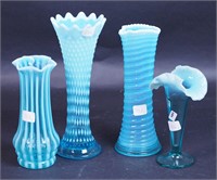 Four blue non-matching opalescent vases,