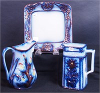 Two non-matching flow blue pitchers with luster