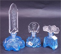 Three blue cut glass perfume bottles