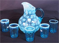 A six-piece blue opalescent water set with