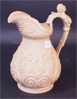 A beige Parian ware pitcher with
